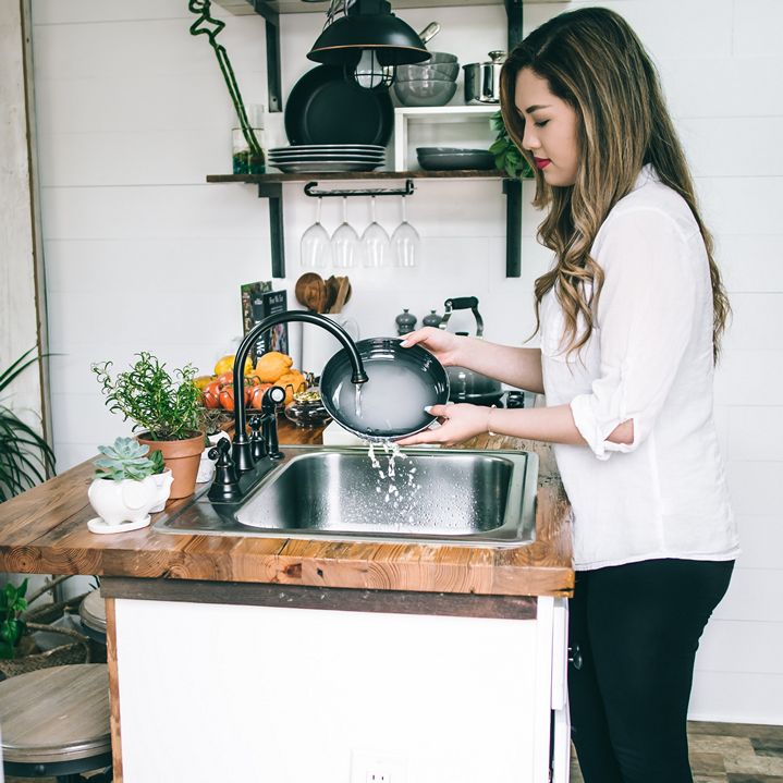 Woman washing dishes